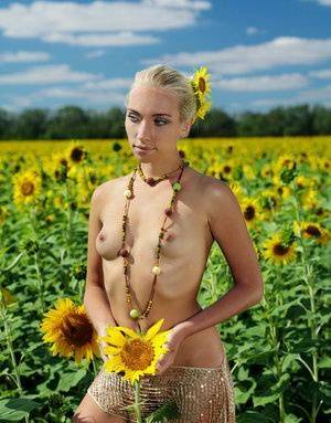 Amidst a large field of sunflowers in full bloom, Adele&39s natural beauty is on adultfans.net