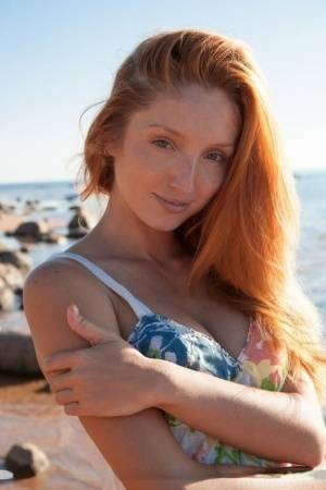 Hot redhead Michelle H flaunting her big tits & tight pussy on the beach on adultfans.net