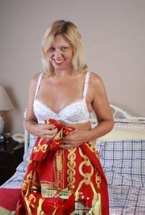 Older blonde lady removes hot white lingerie set for cunt masturbation on adultfans.net