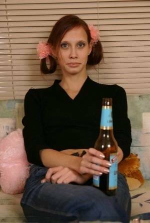 Young redhead chugs a beer before having sex with an older man on adultfans.net