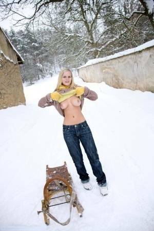 Busty blonde bares big tits in the snow & sucks POV for mouthful of cum on adultfans.net