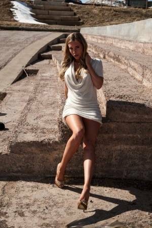 Hot blonde in white dress flashes pierced tits & naked pussy upskirt outdoors on adultfans.net