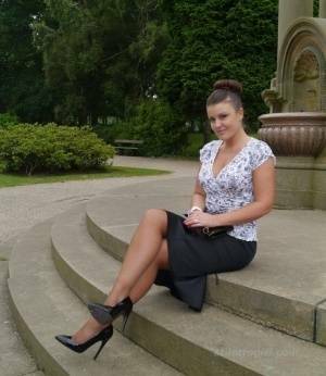 Clothed woman Karen displays her new stiletto heels at a park on adultfans.net