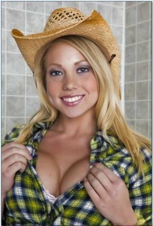 Blond teen babe in a cowboy hat Shawna Lenee goes nude in the shower on adultfans.net