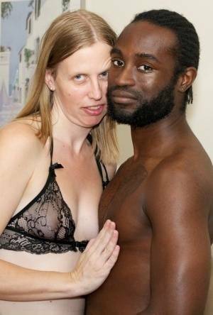 White amateur deepthroats her black lover's cock in lingerie ensemble on adultfans.net