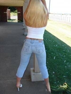Blonde amateur Karen exposes her lace thong while outdoors in faded jeans on adultfans.net