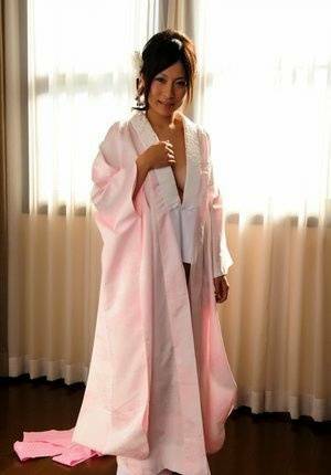 Japanese solo girl slips off her robe to reveal her nice boobs in white socks - Japan on adultfans.net