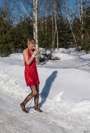 White female is toed up and forced to stand and kneel in snow on adultfans.net