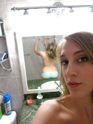 Smiley amateur Cadence Lux stripping and picturing herself in the bath on adultfans.net