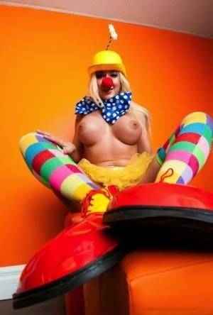 Hot cosplay MILF Leya Falcon in clown costume fondling her huge big tits on adultfans.net