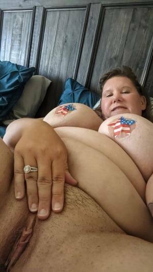 Overweight amateur Busty Krisann poses in the nude around her home on adultfans.net