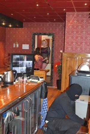 Amateur chick Kimberly Scott and a girlfriend disrobe a hooded male robber on adultfans.net