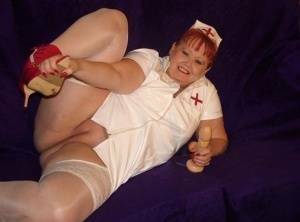 Mature redheaded nurse Valgasmic Exposed exposes herself during dildo play on adultfans.net