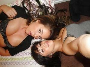 Teen lesbians April Oneil and Ella Milano humping and undressing each other on adultfans.net