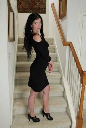 Clothed milf beauty Veronica Stewart is taking off her black dress on adultfans.net