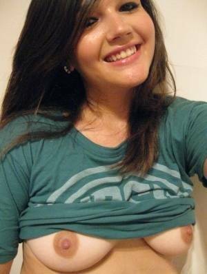 Cutie Veronica takes a slef shot of her nice big tits and firm round ass on adultfans.net