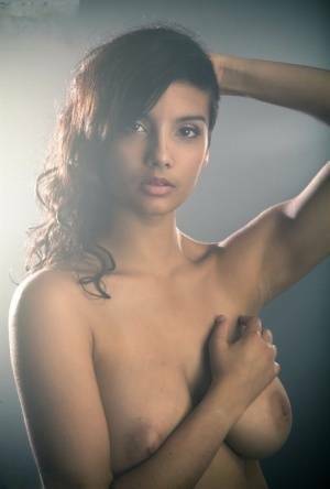 Beautiful Desi female removes her dress to expose her big natural boobs on adultfans.net