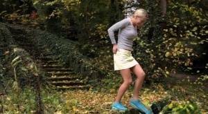 Cute blonde Victoria Pure hikes her skirt to take a pee along country lane on adultfans.net