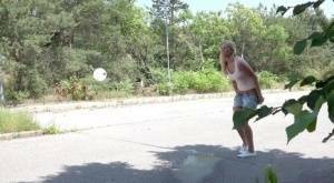 Blonde female Nikki Dream can't hold her pee any longer and squats on roadway on adultfans.net