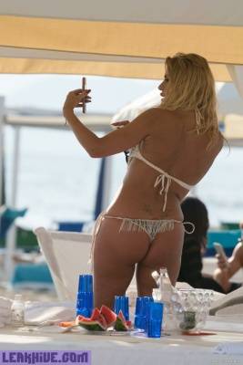 Leaked Valeria Marini Sunbathing In Thong Bikini On A Beach on adultfans.net