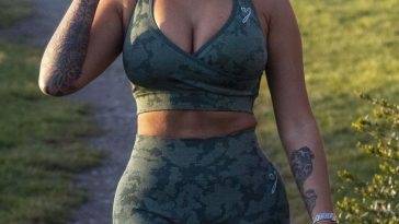 Nikita Jasmine Shows Off Her Ample Cleavage in a Camouflage Exercise Outfit on adultfans.net