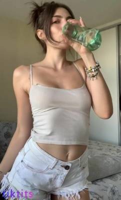 The girl drank the morning dose of water and the rest wet her T-shirt through which her juicy breasts show through on adultfans.net