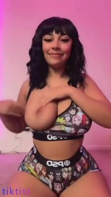 A cheerful athlete with huge naked boobs dances the popular TikTok dance on adultfans.net