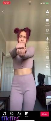Young TikTok girl does a nude dance with TikTok signature moves on adultfans.net