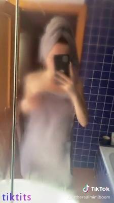 After showering, babe records wet nudes TikTok on adultfans.net