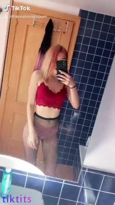 The seductive babe flaunts her gorgeous TikTok boobs in front of the mirror and makes a video on adultfans.net