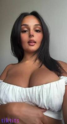 Cute porn star TikTok beckons with big boobs that pop out of her top on adultfans.net