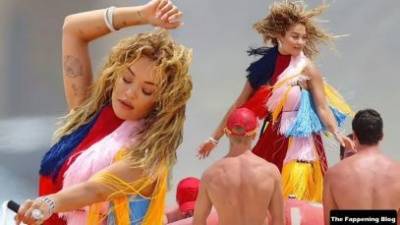 Rita Ora Wears a Bright Dress as She Does a Sexy Shoot at Maroubra Beach on adultfans.net