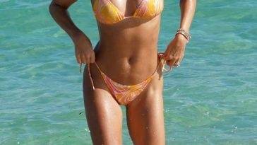 Sylvie Meis Rocks a Skimpy Orange Bikini at the Beach in Miami on adultfans.net