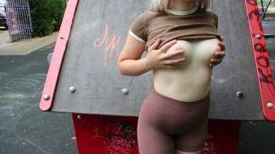 Public flashing in a park with people around on adultfans.net