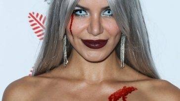Madison Grace Poses on the Red Carpet at the CARN*EVIL Halloween Party in Bel Air on adultfans.net