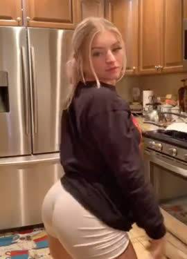 Hot blonde jiggling her ass in the kitchen on adultfans.net