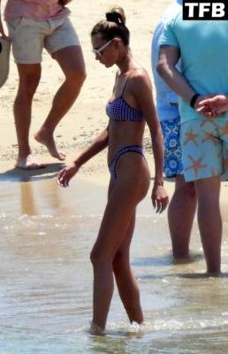 Alina Baikova Displays Her Slender Bikini Body on the Beach on adultfans.net