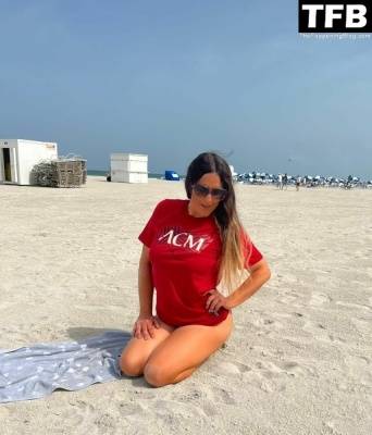 Claudia Romani Supports AC Milan on the Beach in Miami on adultfans.net