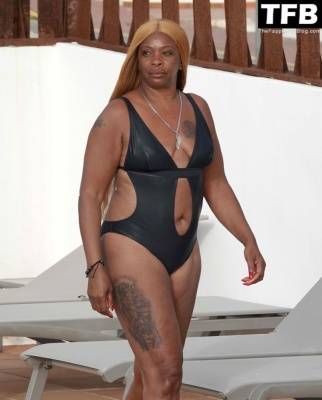 Sandi Bogle Shows Off Her Voluptuous Figure in a Swimsuit Poolside Out in Ibiza on adultfans.net