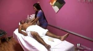 Asian brunette Morgan Lee dose handjob to a guy while massaging him on adultfans.net