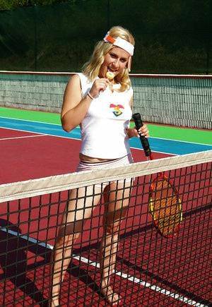Sporty babe with big tits Angel B toying her cunt on the tennis court on adultfans.net