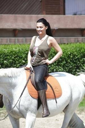 Pornstar Aletta Ocean is riding a horse outdoor in glasses on adultfans.net