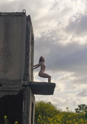 Natural redhead Elis B poses for a daring nude shoot in an derelict building on adultfans.net
