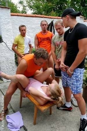 Clothed Euro slut takes on five men during a gangbang on patio on adultfans.net