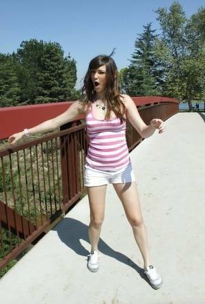 Flexible babe in shorts Holly Michaels shows her sports body outdoor on adultfans.net