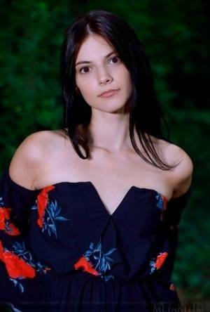 Beautiful teen Aleksandrina gets totally naked while in a forest on adultfans.net