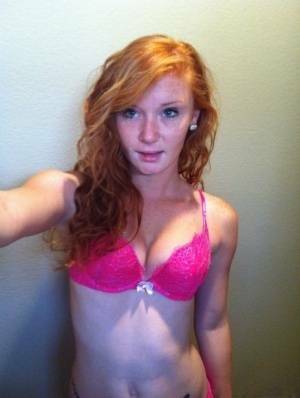 Natural redhead Alex Tanner slips off her pink lingerie set for nude selfies on adultfans.net