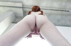 Young redhead Dolly Little revealing shaved pussy in pigtails and socks on adultfans.net