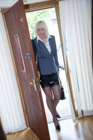 Older MILF Jan Burton strips off business clothes after a hard day at office on adultfans.net