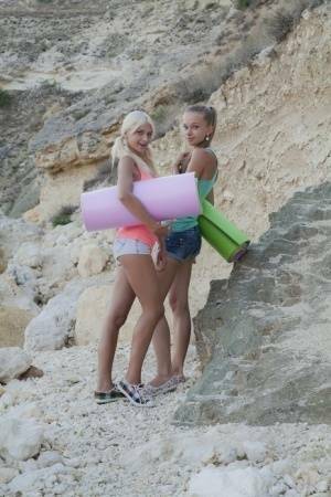Young hotties Nika N & Milena D head to the hills for lesbian sex on yoga mats on adultfans.net